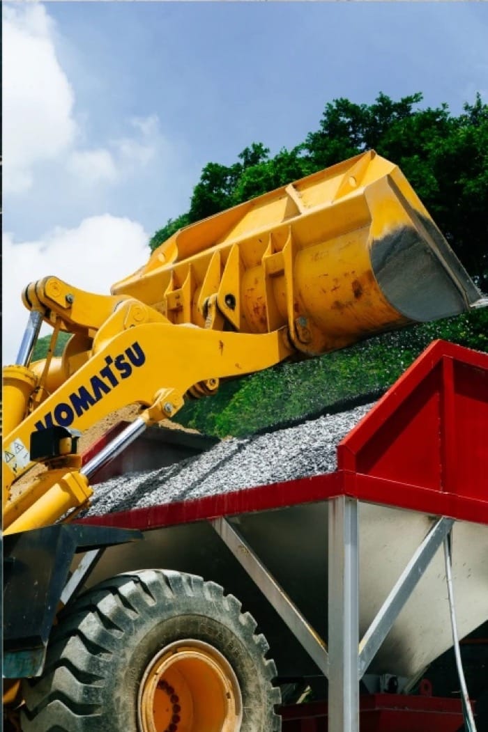 A wheel loader feeding aggregate