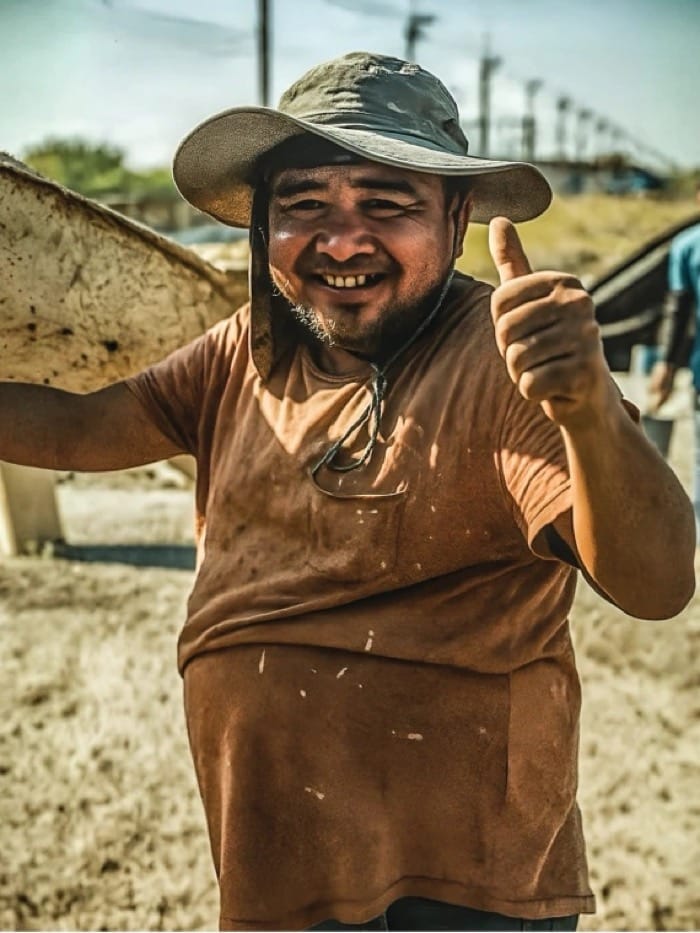 A site worker smiling, thumbs up