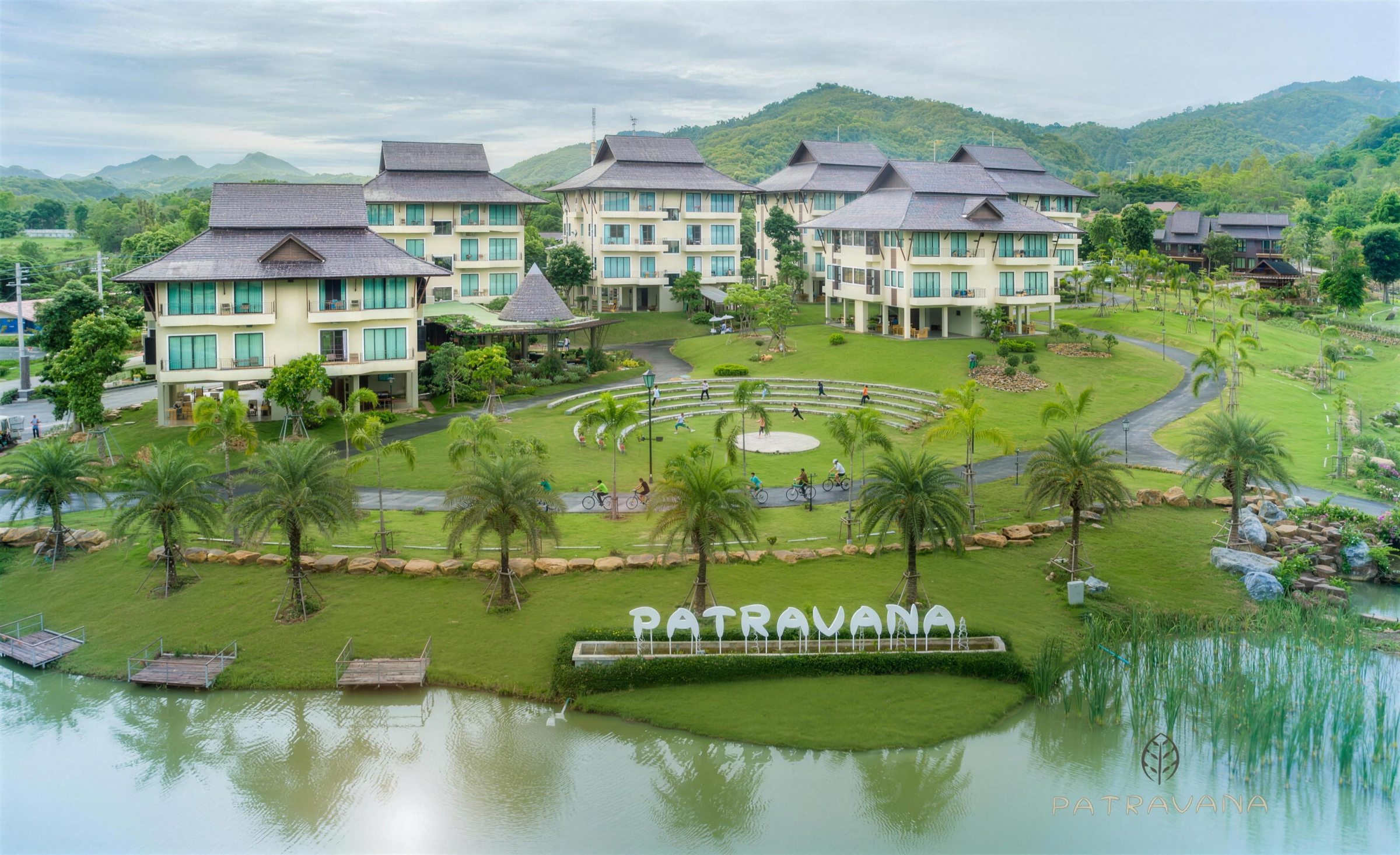 Aerial view of Patravana Resort, its lake and the hills
