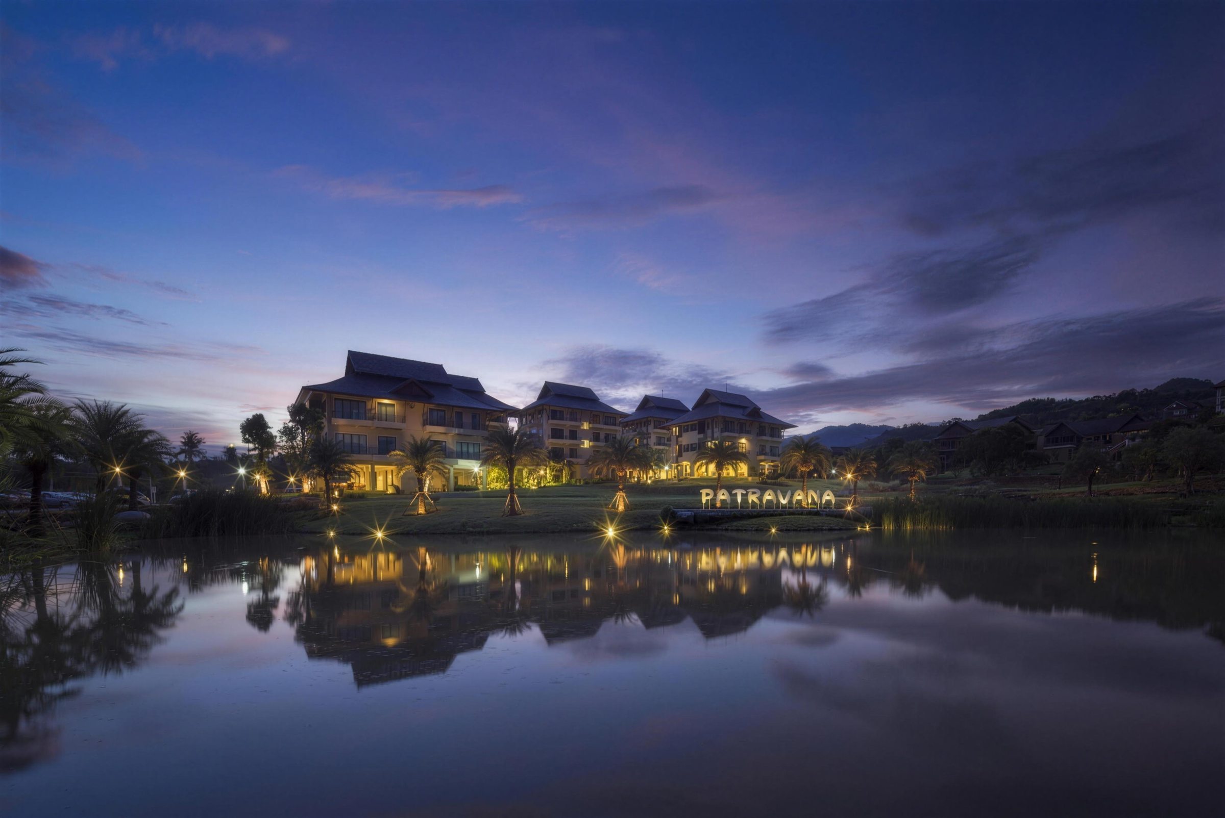 The resort reflected in the lake at dusk