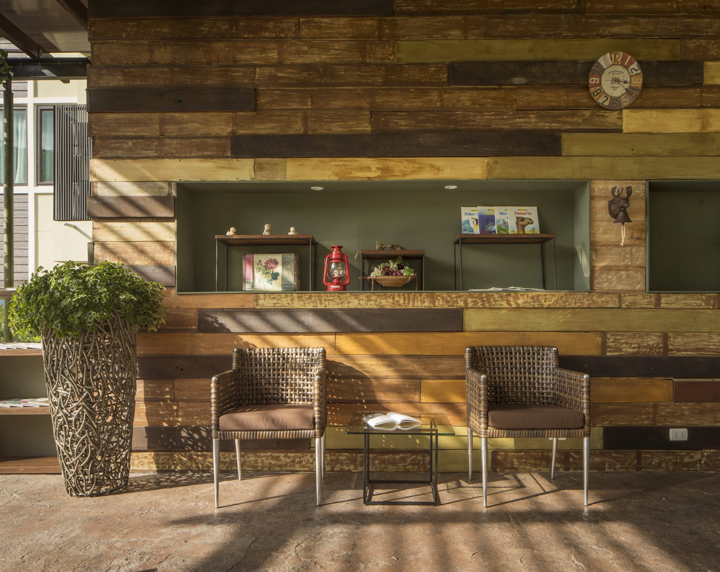 Timber-lined reception with woven chairs